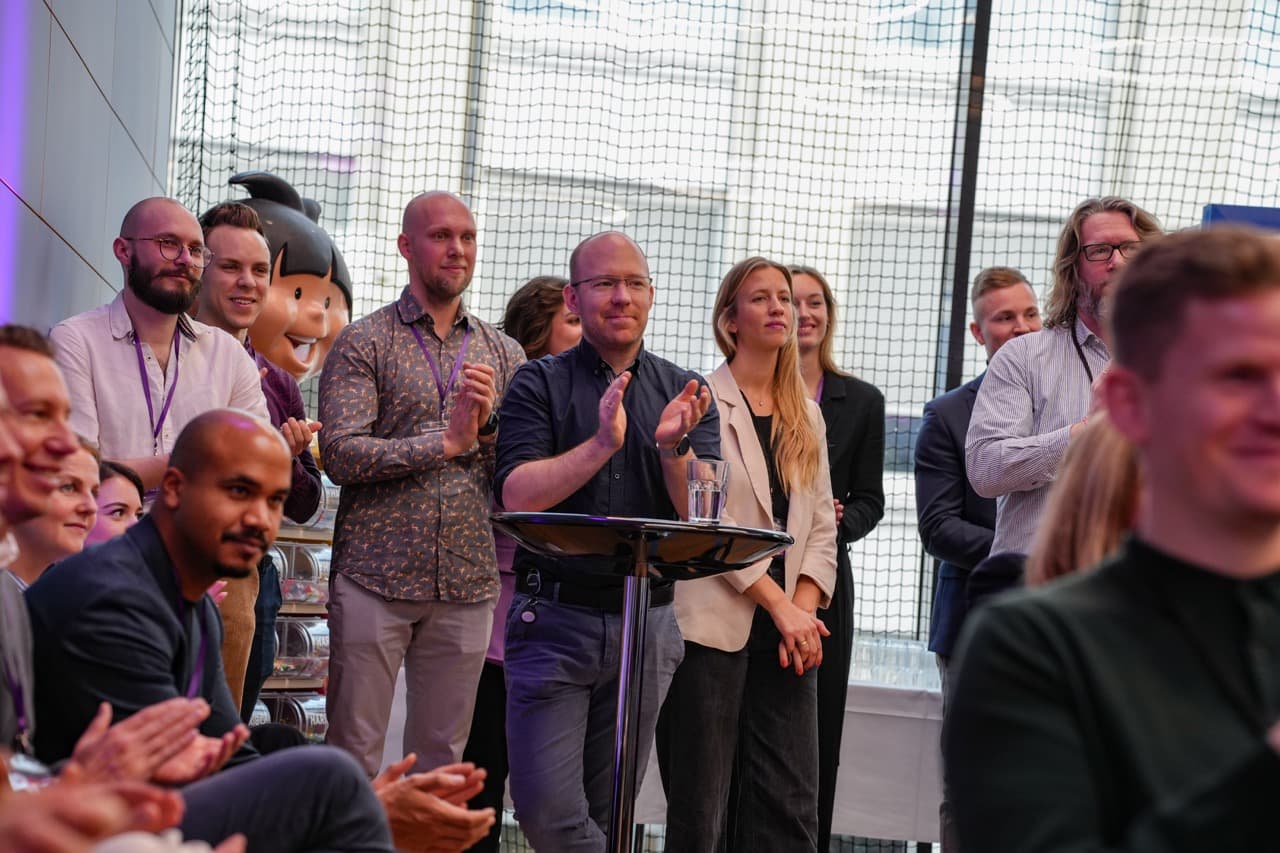 Applaudierendes Publikum während einer Präsentation beim MUUUH!nWalk zum Thema Future of Customer Care